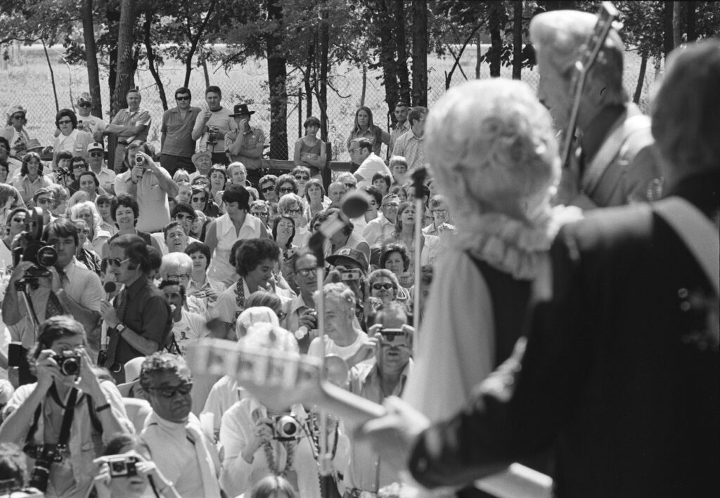 Paul McCartney (left center rear) and family in crowd listening to Porter Wagoner and Dolly Parton perform at Opryland, Nashville, Tennessee, June 16, 1974. Photo by Les Leverett, courtesy of the Grand Ole Opry Archives.
